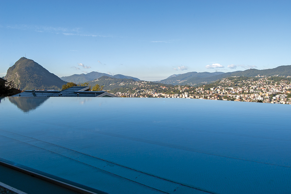 Infinity pool of the Reka holiday village in Albonago, overlooking the Gulf of Lugano